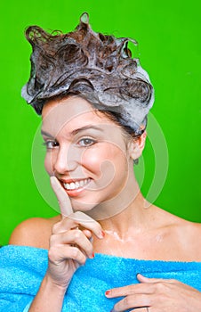 Woman with shampoo foam on her hair