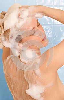 Woman shampooing hair