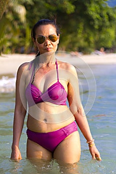 Woman shape big in bikin on beach