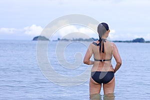 Woman shape symnol bikini on beach