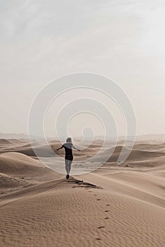 Woman in the Sharjah desert photo