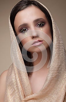 Woman in Shawl with Dramatic Stagy Makeup photo