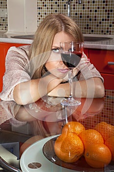 Woman in shine dress with glass of wine