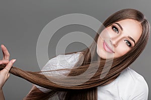woman with shiny straight long hair.