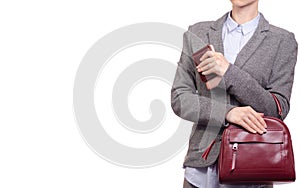 Woman in shirt and jacket holding a mobile phone and purse handbag business