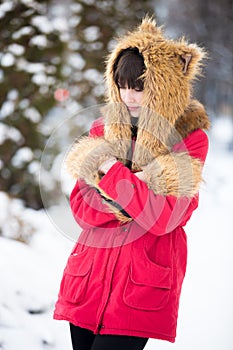 Woman shivering from cold outdoors in wintertime