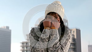 Woman shivering on a winters day