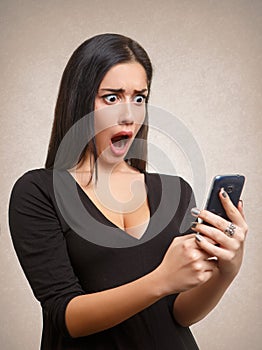 Woman shocked by mobile phone news or message