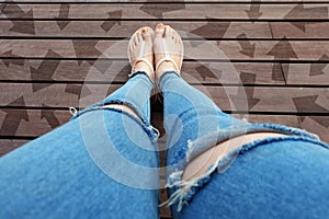 Woman Shoes with Drawn Direction Arrows Choices. Woman Feet and Sandal Standing on Wooden Floor Background