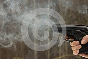 Woman shooting outdoor with a gun