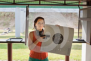 A woman at a shooting range