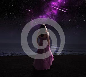 Woman and shooting stars. photo