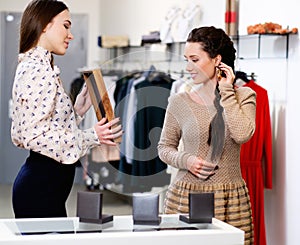 Woman and shop assistant in a showroom