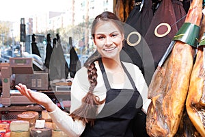 Woman in a shop selling jamon