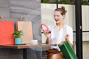 Woman shopper is delighted with the product she bought