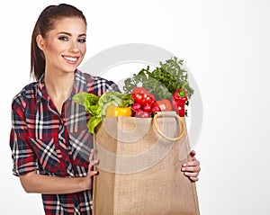 Woman shopping bag of vegetables