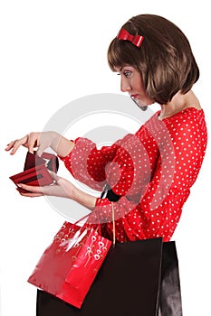 Woman with shopping bags and no money in purse