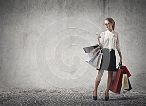 Woman shopping checking her phone