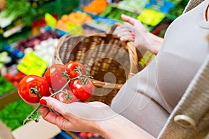 Woman shopping groceries on farmers market