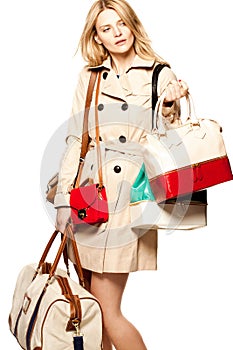 Woman, shopping and handbag in studio for fashion deal, discount or accessories with white background, Choice, sale and