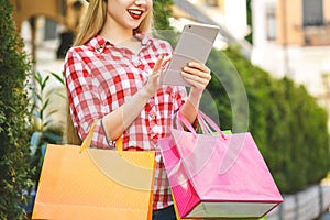 Woman in shopping. Happy woman with shopping bags enjoying in shopping. Consumerism, shopping, lifestyle concept