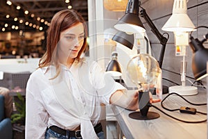 Woman shopping for home lighting