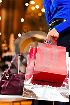 Woman shopping in Mall with bags