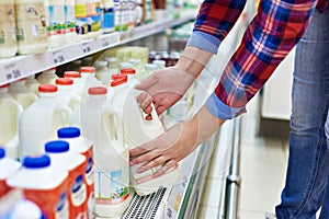 Woman shopping milk in store