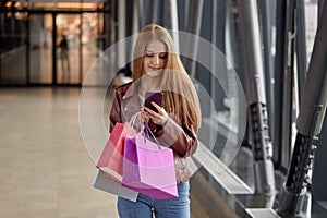 Woman shopping online with shopping bags. Gifts for holidays, birthday.