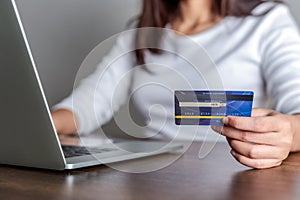 Woman shopping online with credit card and using laptop for online shopping, Online payment concept