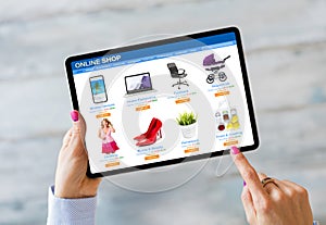 Woman shopping on online store by using tablet