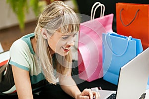 Woman shopping online via Internet from home