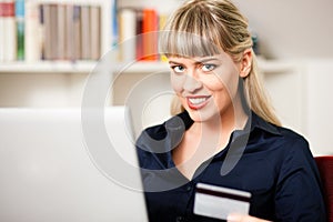 Woman shopping online via Internet from home