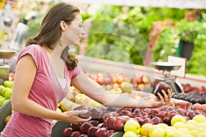 Woman shopping in produce department