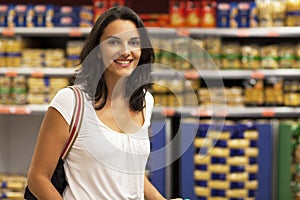 Woman shopping in supermarket photo