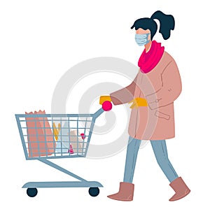 Woman shopping in supermarket with trolley, lady wearing mask