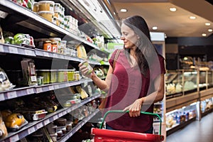 Woman shopping in supermarket photo