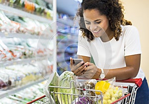 Woman shopping vegetables at the supermarket