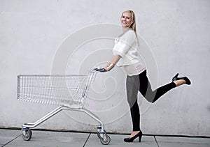 Woman with shoppingcart photo