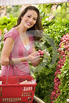 Woman shoppping in produce section