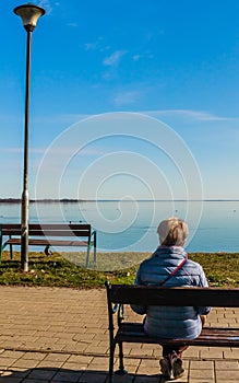 Woman on the shore of Lake Balanon Hungary