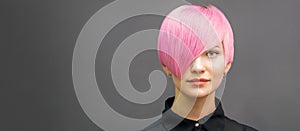 Woman with short bright pink hair