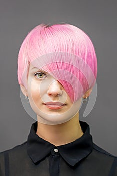 Woman with short bright pink hair