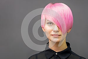 Woman with short bright pink hair