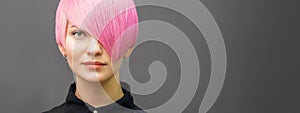 Woman with short bright pink hair