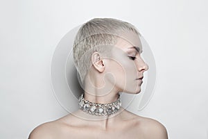 Woman with short haircut and vintage rhinestone chocker