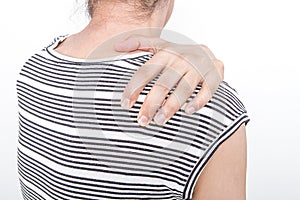 Woman with shoulder pain or stiffness. Health care concept.