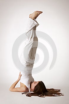 Woman in shoulder stand Yoga posture (Sarvangasana