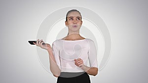 Woman shouting and argue on the phone on gradient background.