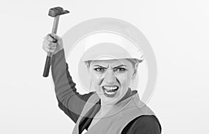 Woman with shouting face holds hammer, isolated on white background.